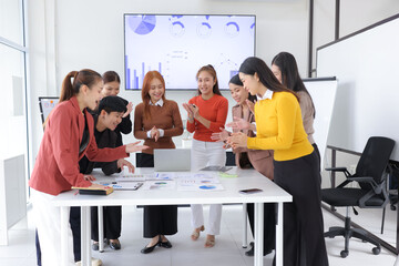 Teamwork of business people brainstorming with financial data graph analysis on the table in the...