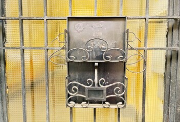 Ornate iron mailbox.