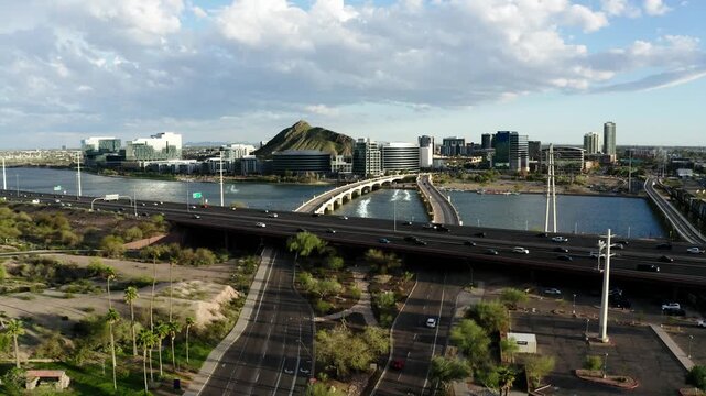 Cars driving along the Red Mountain Freeway just outside of Tempe, Arizona's downtown area.