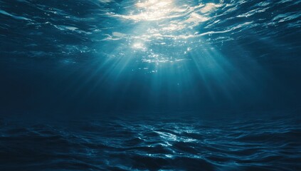 Underwater scene, sunlight beams through the surface