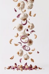 Fresh garlic and onions in motion for recipe, cooking, flavor enhancement or herbal remedy concepts.

