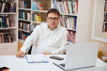 Business man working on laptop online in office