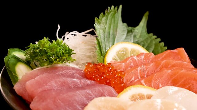 Rotating Assorted Sashimi and Sushi Platter on Black Background
