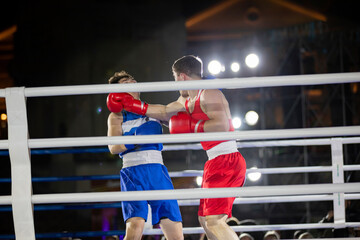 Boxing athletes fight with gloves