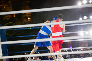boxers fight with gloves in the ring punch hook