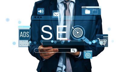 Businessman in suit holding tablet with SEO, ads, and digital icons on white background, illustrating online marketing and business strategy concept