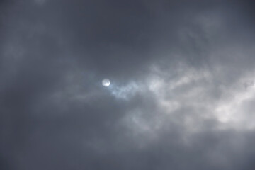 Fototapeta premium Sunlight behind clouds of a dramatic winter sky in California