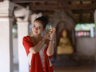 A tourist woman travels to a temple, Northern Thailand. Wat Ton Kwen at Chiang Mai Thailand.
