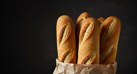 Freshly Baked Baguettes in a Paper Bag against Dark Backdrop Still Life