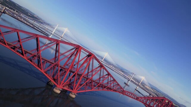 360 degrees spinning aerial video of the three Firth of Forth Bridges in Scotland - UK 