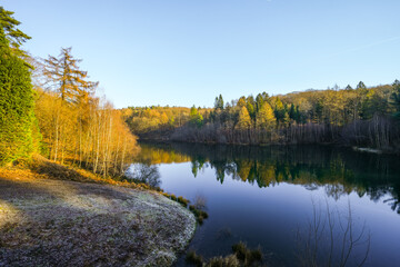 Fototapeta premium View of the Ronsdorf Dam and the surrounding landscape in autumn. Nature at the lake near Wuppertal. Saalbach Dam. 