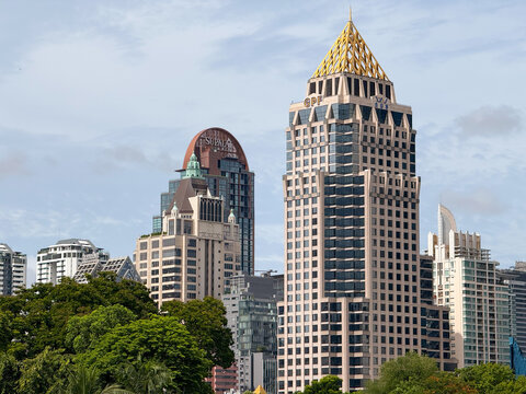 Bangkok, Thailand - June 21, 2025: GPF Witthayu Tower and luxury skyscrapers viewed from Lumphini Park