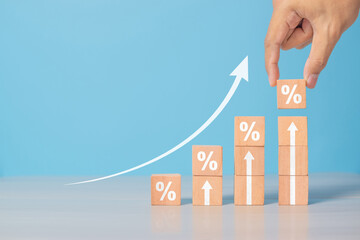 Interest rate financial and mortgage rates concept. Wooden blocks with Icon percentage symbol and...