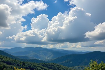 warm air uplift by hills forming fluffy cumulus clouds above green slopes natural weather development