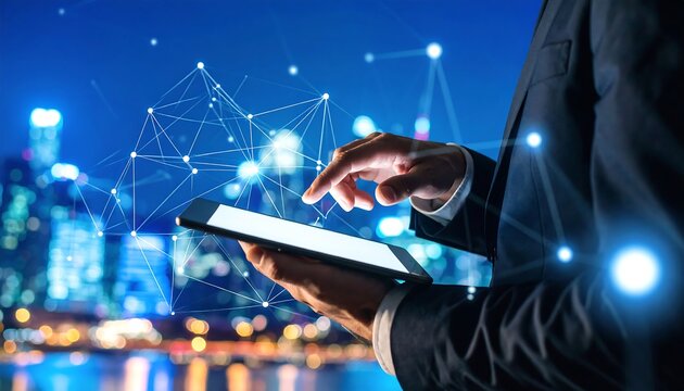 Businessman using tablet at night