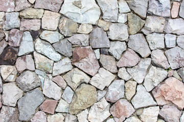 A wall made of rocks with a grey and white color
