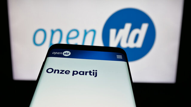Stuttgart, Germany - 07-11-2025: Mobile phone with website of Open Vlaamse Liberalen en Democraten Open VLD on screen in front of logo. Focus on top-left of phone display.