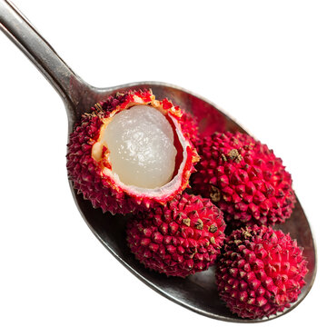 Fresh lychee fruits displayed in a silver spoon, showcasing their vibrant color and texture
