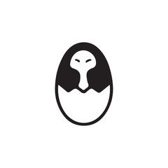 Black and white graphic of a hatching egg with a stylized bird face vector