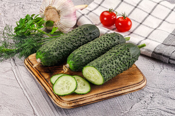 Raw green cucumbers with slices