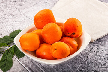 Raw ripe sweet apricots heap