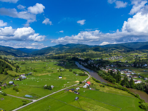 Landscape with a beautiful rural area in Bucovina - Romania seen from above. Aerial view of a village in Romania