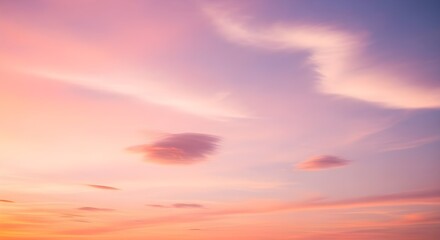 Obraz premium Beautiful Pastel Colored Sky with Soft Clouds at Sunset or Sunrise