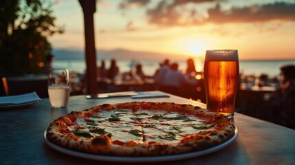 Italian pizza with beer at sunset