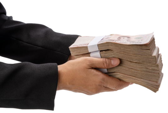 Hand holding a stack of Thai baht banknotes isolated on white with clipping path , concept of payment, corruption, or financial transaction