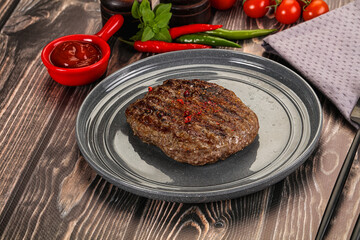 Grilled beef burger cutlet with sauce