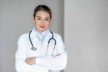 Portrait of a confident female doctor with a stethoscope in a white coat