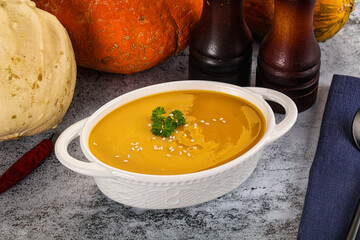 Vegan pumpkin cream soup served sesam