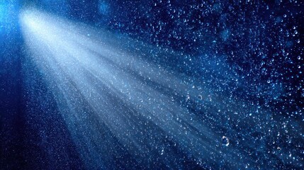 Radiating light through a surface covered in water droplets.