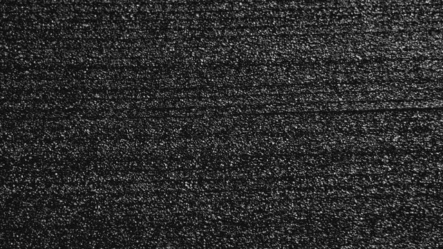 Black porous packaging foam material with textured surface