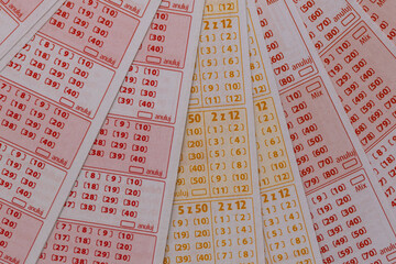 Tickets for a numbers game, big lottery win, blank unmarked tickets in an international lottery,