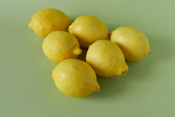 Lemons on a green background. Close-up image.