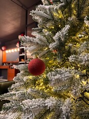 Christmas Tree with Red Ornament in Modern Barbershop Interior