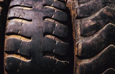 Used Grader Wheel with Dirt and Rust, The image captures the rough, rugged texture of the rubber, emphasizing the wear and tear