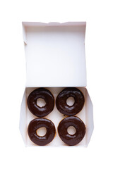 Top view of four chocolate glazed donuts in a paper box isolated on transparent background