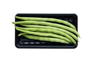 Bush snap beans in a black plastic tray isolated on transparent background