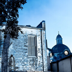 old brick house in the city with a clock tower