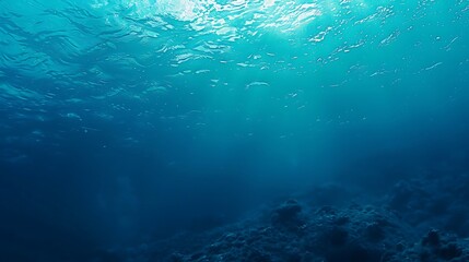 Ocean depth gradient blending light turquoise to navy blue .