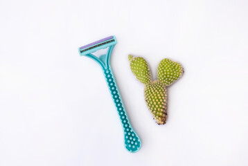 Razor with Prickly cactus on white background, a symbol of shaving