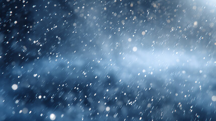 A serene snowfall creates a tranquil atmosphere with soft flakes glistening against the dark blue backdrop, evoking winter's magic.