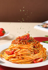 Pasta and pepper on table indoors, brown background
