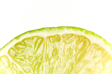 Cut green lemon macro close-up picture white clean background
