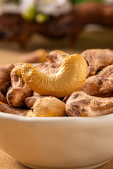 Detail photography of cashew nuts, peeled cashew nuts placed on a bamboo tray