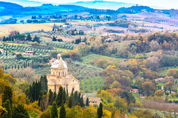 Beautiful colorful Tuscany panoramic landscape with fields, cypress, vineyards, houses, Italy