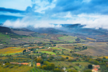 Fototapeta premium Tuscany panoramic landscape with fields, trees and houses