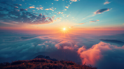 Fototapeta premium Sunrise over a sea of clouds, a breathtaking vista from a mountain peak with colorful light.